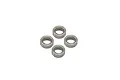 Four small metal shielded ball bearings arranged in a diamond pattern on a white background.