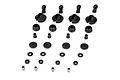 A set of black plastic RC shock absorber components including shock caps, spring retainers, pistons, spacers, and metal ball ends arranged on a white background.