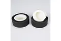 Two cylindrical foam air filters for RC cars, featuring a white inner core and a dark grey outer layer, set against a plain white background.