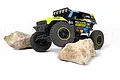 HPI Venture18 U4 Ford Bronco 4400 Flux RC rock crawler in black and neon yellow livery, climbing over two large rocks on a white background.