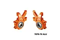 Two orange anodized aluminium RC steering hubs with bearings, marked with L and R, GPM branding, and 7075 material designation.