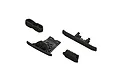 A set of four black plastic RC car parts including bumpers and skid plates from ARRMA.