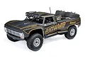 Losi Ford F-100 Baja Rey 2.0 4WD RC short course truck in matte black with gold Heatwave livery, featuring off-road tires and a roll cage.