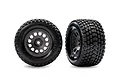 Two Traxxas Gravix RC tires on grey Mini XRT rims, shown from front and angled perspectives against a white background.