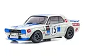 Kyosho Mini-Z Nissan Skyline 2000GT-R RC car in white and blue racing livery with number 15 on the side and hood.