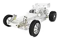 A studio shot of a Team Associated RC10CC Classic 1/10 scale RC buggy kit featuring a clear, unpainted polycarbonate body shell.