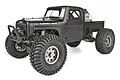 Element RC Enduro Ecto 1/10 scale RC rock crawler in black, featuring a detailed truck body, large off-road tires, and a roll cage.