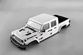 A white 1/10 scale Killerbody Jeep Gladiator Rubicon hard body shell for RC crawlers, shown from a high-angle studio view against a grey background.