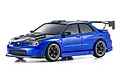A studio shot of a metallic blue Kyosho Mini-Z Subaru Impreza WRX RC drift car with a carbon fiber look hood and large rear spoiler.