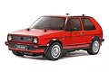 A studio shot of a red Tamiya 1/10 scale RC Volkswagen Golf II GTI model car on a white background.