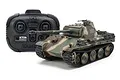 A 1/35 scale Tamiya Panther Type G RC tank model with camouflage paint and its black 2.4GHz radio control transmitter on a white background.