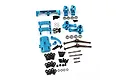 A collection of blue anodized aluminium RC car upgrade parts including suspension arms, hubs, driveshafts, and various screws and bearings.