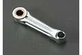 A silver metal connecting rod for a Traxxas TRX 2.5 engine, featuring a bronze bushing at one end.