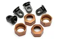 A set of RC shock components including four black plastic shock eyelets and four bronze-coloured metal threaded shock caps.
