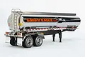 A 1/14 scale Tamiya Gallant Eagle fuel tanker trailer model with a highly reflective chrome finish and eagle decal on a white background.