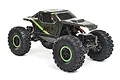 Axial AX24 XC-1 1/24 scale RC rock crawler in green and black, featuring aggressive tread tires with green beadlock rings on a white background.