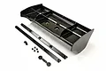 A black Kyosho RC car wing set including a main wing, two support strips, small screws, nuts, and plastic washers on a white background.