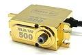Reefs RC RAW500 brushless metal gear servo in a polished gold brass finish, viewed from a high angle against a white background.