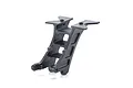 A black plastic Kyosho wing mount spare part for an RC car, shown from a three-quarter angle against a white background.