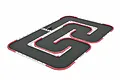 An EasyLap Mini-Z RC home racing track set up on a white background, featuring a grey track surface with white and red modular barriers and a small RC car.
