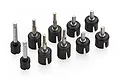 A collection of nine Tamiya RC wheel axle and drive cup assemblies featuring black plastic housings and metal shafts on a white background.