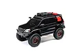 A black Axial SCX24 Lexus GX 470 RC rock crawler with off-road accessories on the roof rack, shown against a white background.