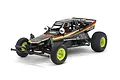 A studio shot of the Tamiya The Grasshopper Black Limited Edition RC buggy, featuring a black body with yellow and red decals and bright yellow wheels.
