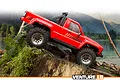 A red HPI Venture 18 RC rock crawler truck driving over a mossy tree stump in a forest setting.