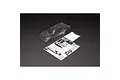 An unpainted clear polycarbonate RC truck body shell for the Arrma Vorteks, shown with a decal sheet and window masks on a black background.