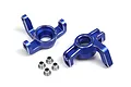 Two blue anodized aluminium steering hubs and four small metal bushings on a white background.