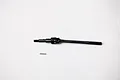 A black metal front CVD driveshaft for an RC car, shown with a small metal pin on a white background.