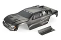 A pre-painted carbon-look Atrek 1/10 Wildfire Pro stadium truck body shell with a separate rear wing on a white background.