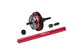 GPM Racing red and black complete centre differential assembly with a long red driveshaft and small pinion gear for RC cars.