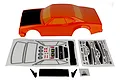 Team Associated 1/10 DR10 Reakt drag car body shell in orange with black hood, including decal sheets, rear spoiler components, and mounting hardware.