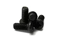 A small pile of four black metal binder head screws with fine threads against a white background.