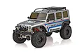 Team Associated RC10 Trail Truck Cattleman 1/10 scale RC rock crawler in silver with racing decals and black off-road tires.
