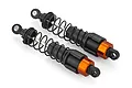 Two Atrek RC rear shock absorbers featuring black plastic bodies, black coil springs, and orange anodized aluminum adjustment collars.