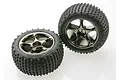 Two Traxxas 2.2 inch Bandit rear Alias tyres mounted on black chrome Tracer rims against a white background.