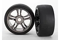 Two Traxxas 3.3 inch front S1 slick tyres mounted on black chrome multi-spoke rims, shown against a plain white background.