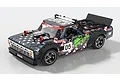 A 1/10 scale UDI RC Radical drift truck with a blue, white, and red American flag-themed livery and racing decals on a white background.