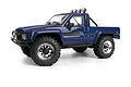 A blue 1/18 scale HPI Venture18 1985 Toyota Hilux SR5 RC rock crawler truck shown from a front three-quarter angle against a white background.