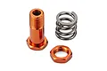 An orange anodized aluminium servo saver post, a matching orange nut, and a steel coil spring on a white background.