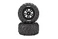 Two Atrek monster truck off-road tyres mounted on black rims, stacked vertically against a white background.