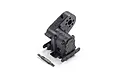 A black plastic RC transmission gearbox assembly and a separate small plastic driveshaft component on a white background.