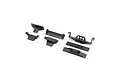A set of black plastic RC battery tray components and chassis mounts from Axial, arranged on a white background.