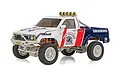 Team Associated RC10 4X4 pickup truck RC rock crawler in white, red, and blue livery with Rhino Paradise decals on a white background.