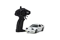 Kyosho First Mini-Z Initial D Mazda Savanna RX-7 FC3S RC car in white with its black pistol-grip transmitter on a white background.