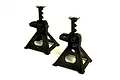 Two black 1/10 scale RC jack stands standing on a white background.