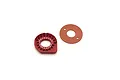 A red anodized aluminium Kyosho motor mount with gear mesh adjustment holes and a circular gasket on a white background.
