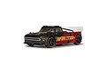 ARRMA Infraction 223S RC drift truck in black and red livery, featuring a low-profile body, large rear wing, and black wheels on a white background.